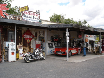 Vintage car and classic motorcycle at Hackberry General Store, Route 66 USA.